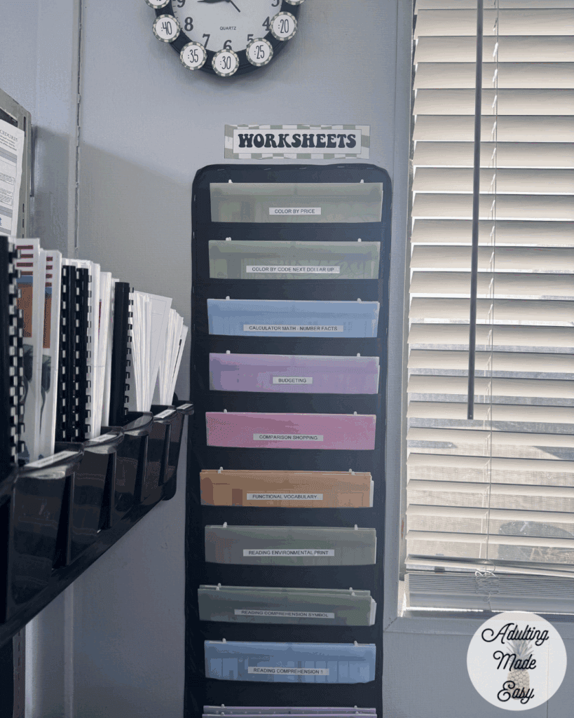 A file organizer containing worksheets with colorful folders organized by subject.